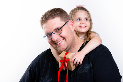 Happy father's day! cute dad and daughter hugging on white background. Copy space.