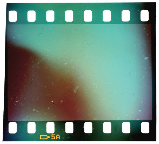 Real and original 35mm or 135 film material or photo frame on white background, 35mm filmstrip with empty window or cell with dust stock photo