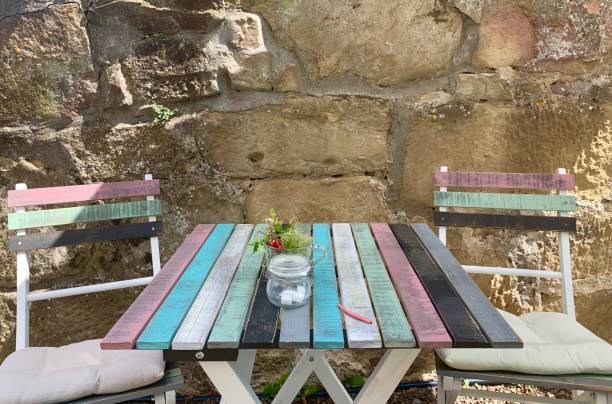 Rustic wooden table and benches providing a peaceful resting spot in a park setting