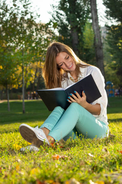 istock College student reading in a city park 1169417400