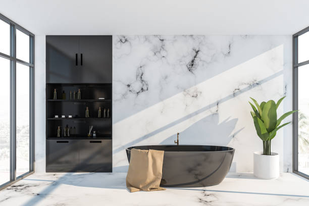 istock Black and white bathroom interior with tub 1169417614