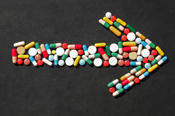 istock arrow of pills 1169418626