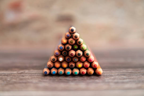 Set of colorful pencils on a wooden background. Set of colorful pencils on a wooden background. pyramid photos stock pictures, royalty-free photos & images