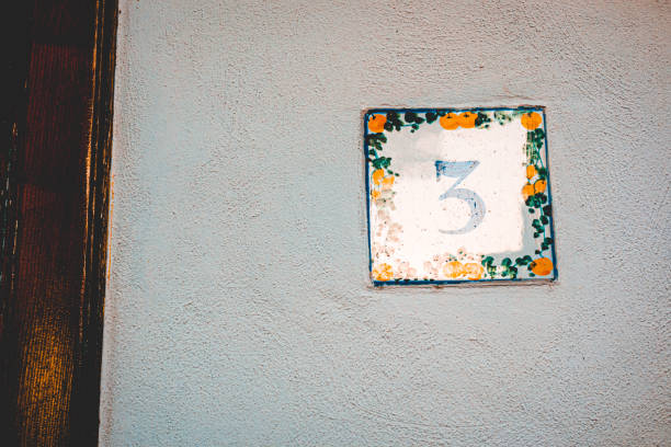 istock typical mediterranean door sign with number 3 1169420065