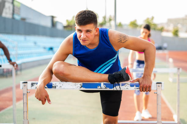 istock Athlete Man Preparing And Runs Hurdles for Track and Field 1169423818