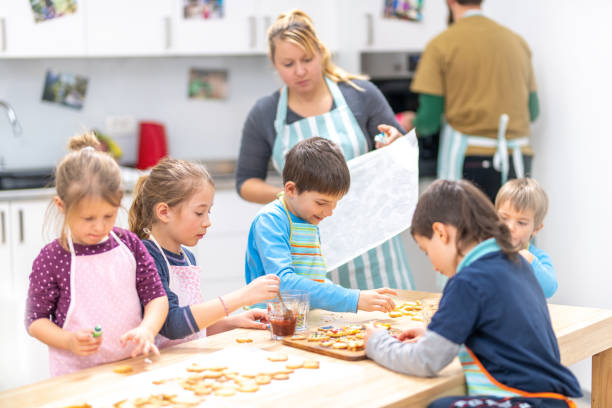 istock Children making cookies 1169425255