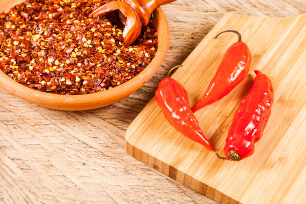 istock red pepper or cayenne pepper crushed with flakes scattered 1169427531