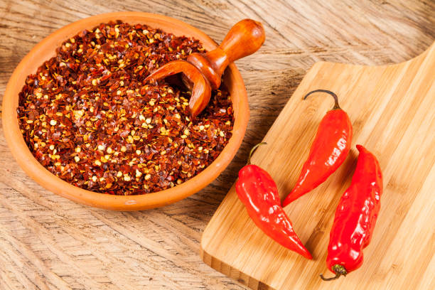 istock red pepper or cayenne pepper crushed with flakes scattered 1169428616