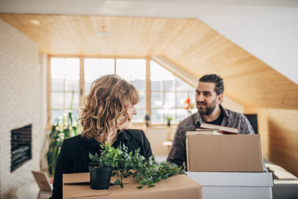 istock Couple moving in into new apartment 1169431812