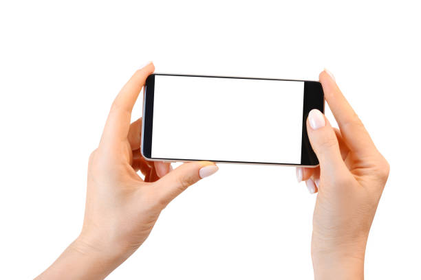 istock Template of smartphone with empty white screen in female hands isolated on white. 1169433497