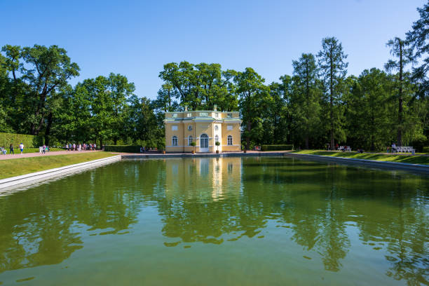 House on a Lake in Tsarskoye Selo St Petersburg, Russia -- July 22, 2019. Wide angle shot of a house on a lake on the grounds of Catherine Palace near St Petersburg st petersburg catherine palace palace russia stock pictures, royalty-free photos & images