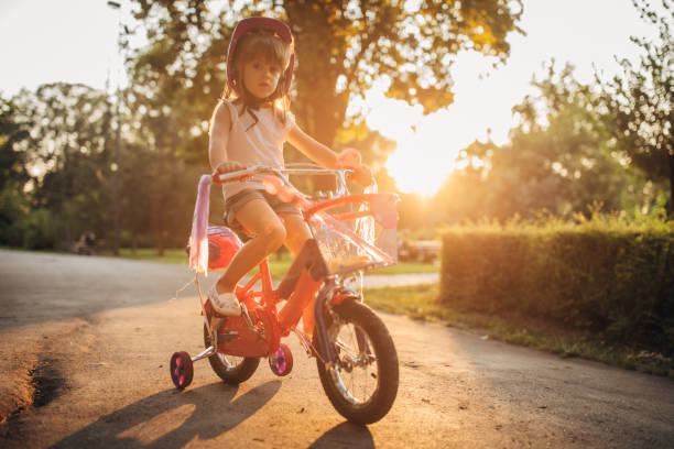 istock Girl learning to drive a bicycle 1169434372