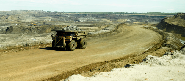 A large industrial dump truck in the oil sand region of Canada.