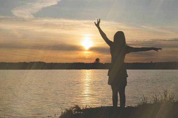 istock Silhouette of young dancing woman. 1169435566