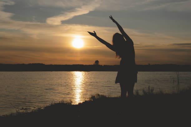 istock Silhouette of young dancing woman. 1169435634