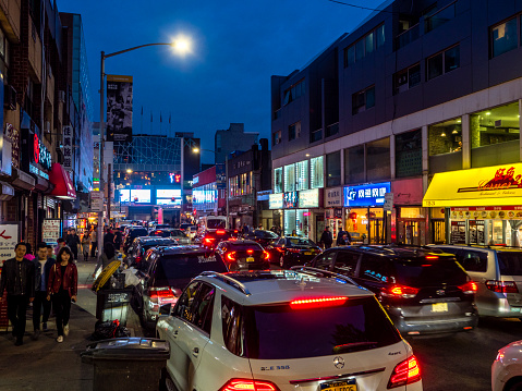 New York City, USA - May 04, 2019: Night view of 40 Road near Main Street in Flushing - a neighborhood in the New York City borough of Queens.
