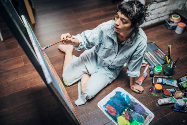 istock Artist working in her studio 1169436900