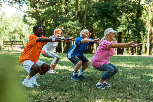 istock selective focus of multicultural senior men and women doing sit ups on grass 1169439851