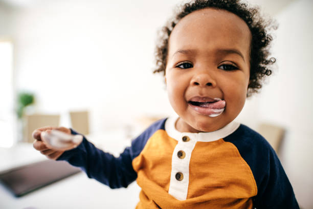 istock Toddler eating yogurt 1169440563
