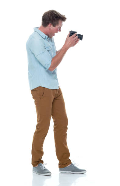 istock Handsome male photographer 1169440833