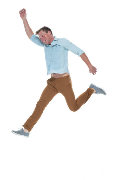 istock Casual well dressed man jumping 1169440952