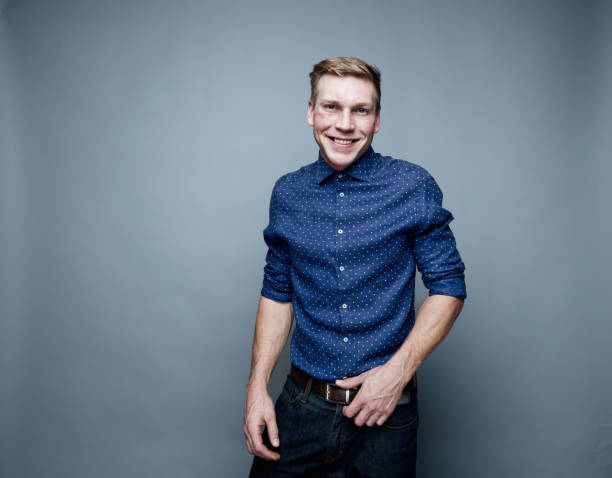 istock Handsome man wearing blue button down shirt 1169441804