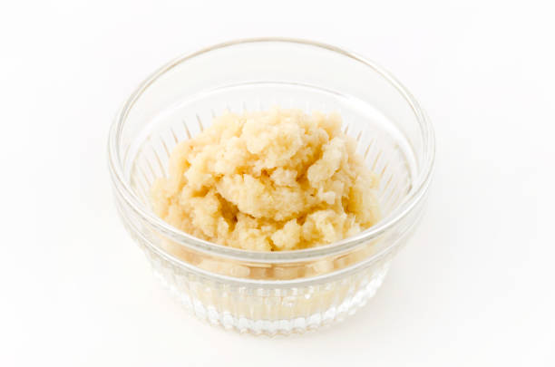 istock Grated ginger in Glass Bowl on white background 1169442100