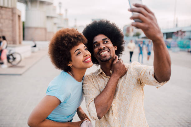 istock Young, happy couple taking a selfie during a romantic journey 1169443151