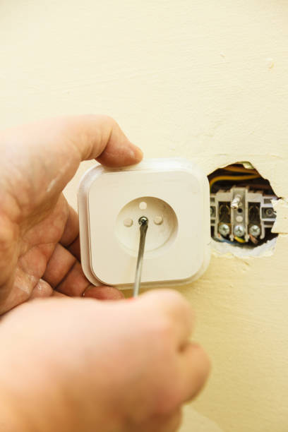 istock Person removing electric power socket plug 1169443451