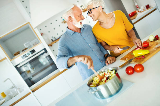 istock Mature couple cooking lunch together. 1169443914