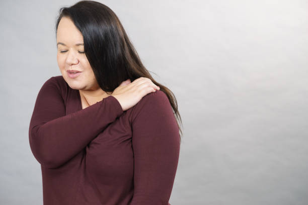 istock Woman with pain in shoulder 1169444774
