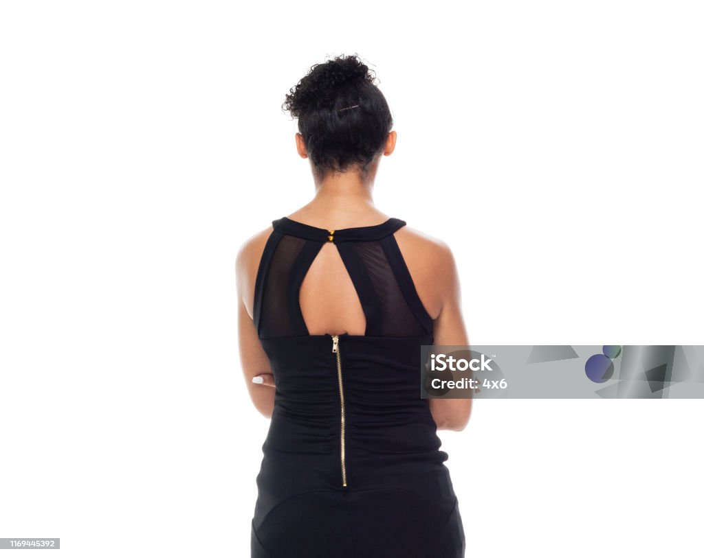 Beautiful black woman wearing cute black dress - arms crossed 20-24 Years Stock Photo