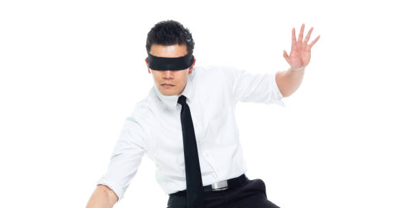 istock Handsome Asian Businessman - is wearing a blindfold 1169447455