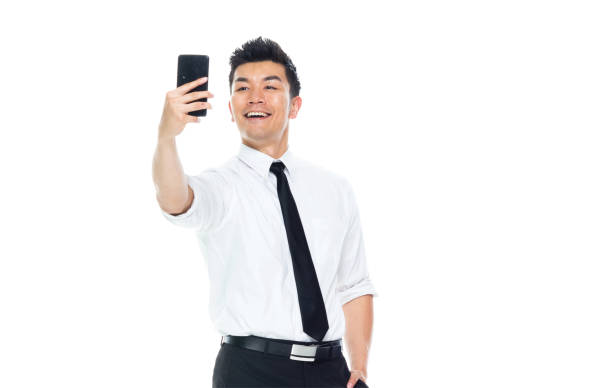 istock Handsome Asian Businessman - is taking selfie 1169447471