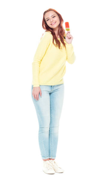 istock Beautiful eating a popsicle 1169450128