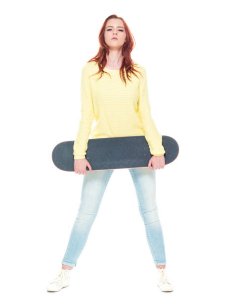 istock Cute female holding a skateboard 1169450163