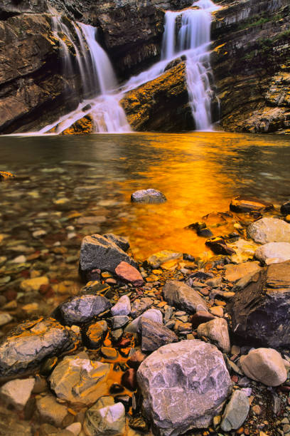 Morskie Oko, or Eye of the Sea. View of the Dwoista Siklawa waterfall. Summer landscape in the Tatras, Poland.