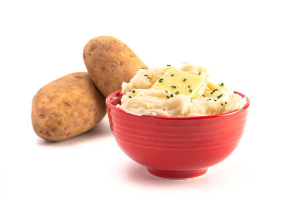 A Bowl of Creamy Mashed Potatoes with Chives on Top Isolated on a White Background A Bowl of Creamy Mashed Potatoes with Chives on Top Isolated on a White Background mashed potatoes stock pictures, royalty-free photos & images