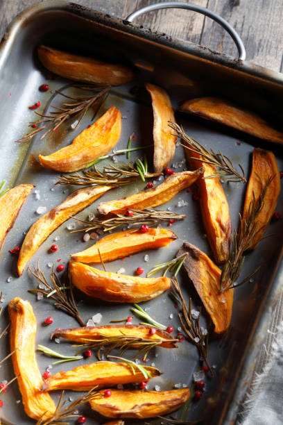 Roasted orange sweet potatoes with fresh rosemary.