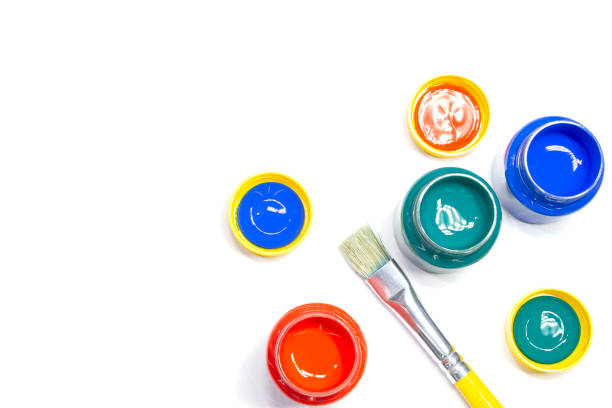 istock Jars of colored paint and brush 1169457543