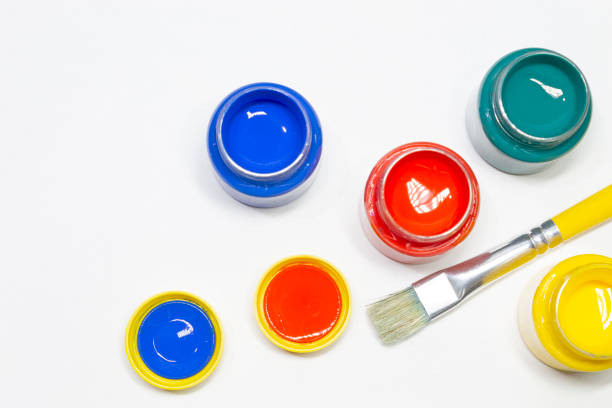 istock Jars of colored paint and brush 1169457606