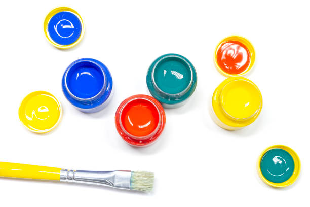 istock Jars of colored paint and brush 1169457700