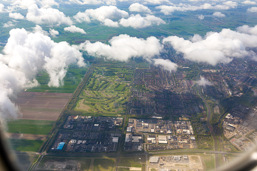 High angle view on Holland cityscape among the  white clouds.