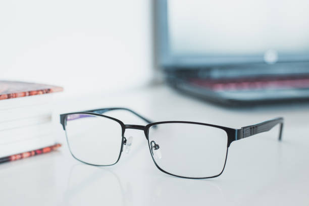 istock Glasses with book and laptop 1169474312