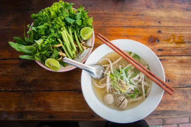 Photo of Close up of Pho noodle soup in restaurant in Luang Prabang, Laos.