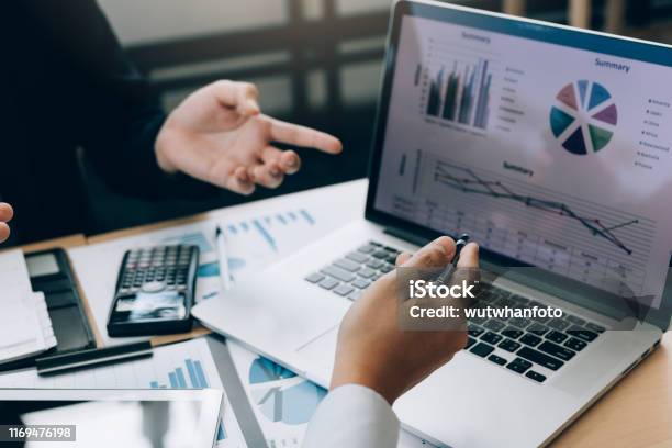 Colleagues Are Stress Talking About The Results Report And Compared With The Financial Information On The Laptop Screen Stock Photo - Download Image Now