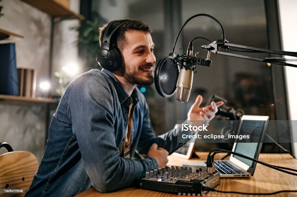 I will tell a joke now Colleagues in radio station making show Podcasting Stock Photo