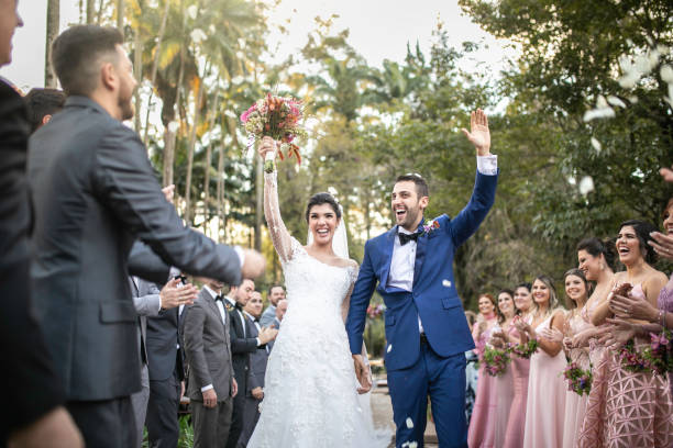 istock Confetti throwing on happy newlywed couple 1169477264