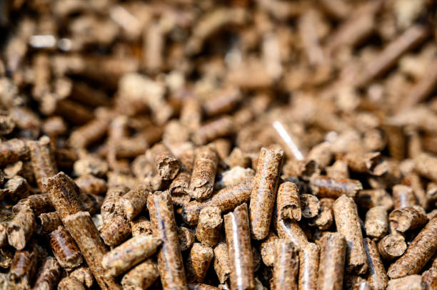 Pellets for barbecue wood smoker pile of brown fuel for cooking granule photos stock pictures, royalty-free photos & images