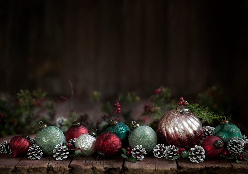 Christmas holiday vintage-rustic baubles and ornaments on a rustic wood background